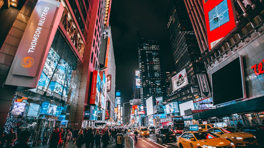 Crowd of People on Street during Night Time